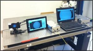The high-resolution microendoscope was first developed using a laptop computer (right), then a tablet (middle), but to make the devise even more portable researchers have developed a new version that works with a cellphone (left).